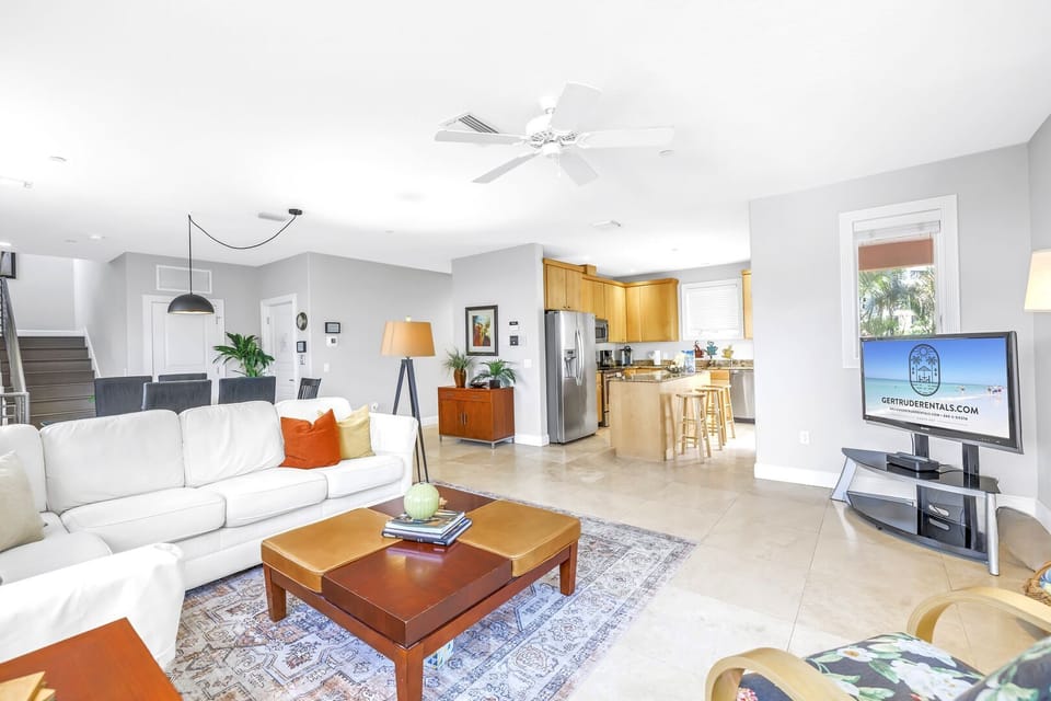 Large living area flows to kitchen and balcony