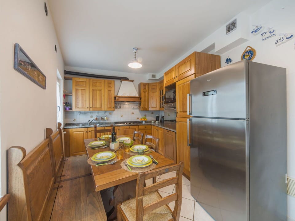 Furniture, Kitchen, Interior Design, Flooring, Countertop, Wood, Major Appliance, Cabinetry, Kitchen Appliance, Floor