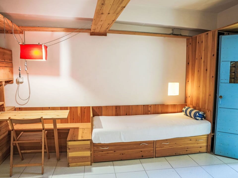 Furniture, Wood, Interior Design, Lighting, Flooring, Room, Floor, Ceiling, Wood Stain, Bed