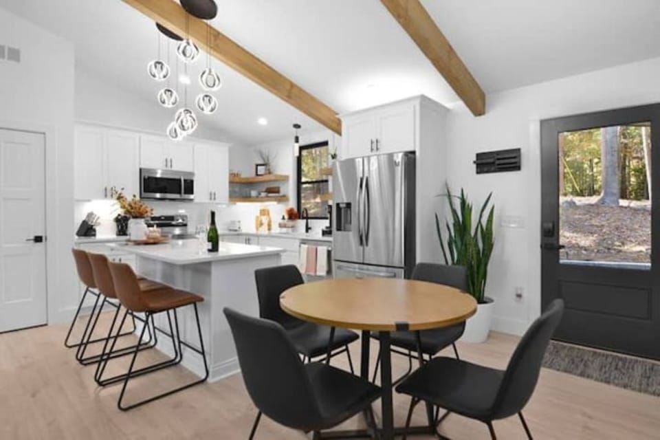 Enjoy an open kitchen w/ island seating, full appliances & dining table charm.