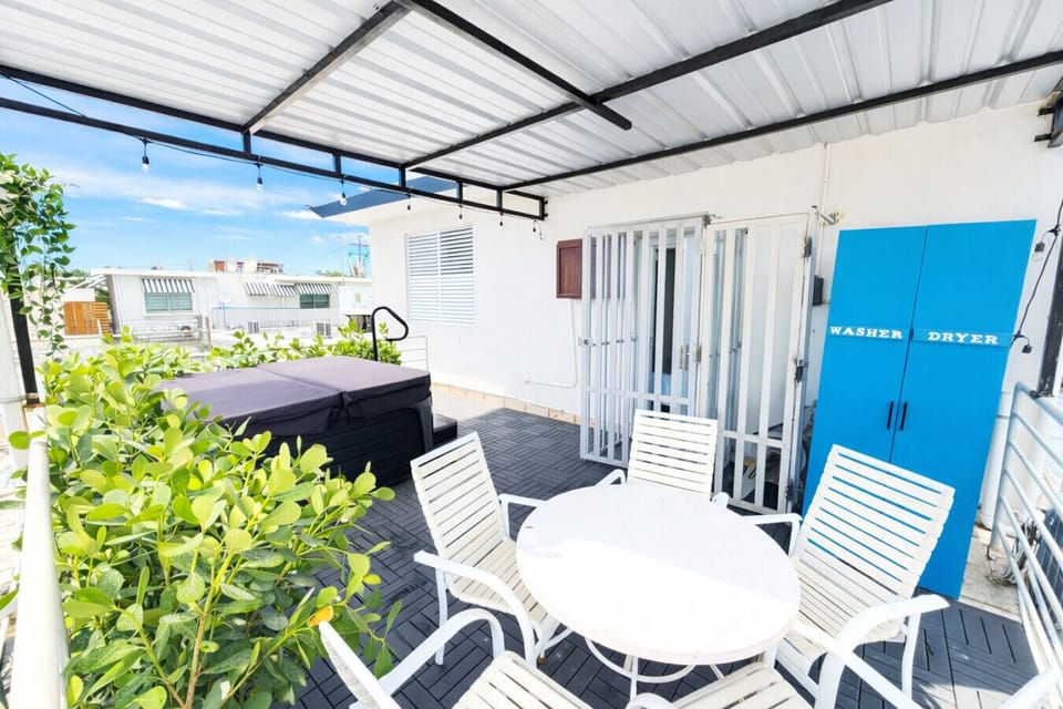 Private  terrace with hot tub, seating area and laundry