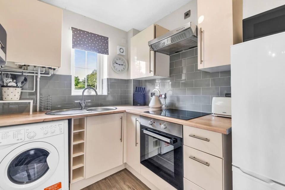A fully equipped kitchen stocked with all the essentials you need to prepare and enjoy a home-cooked meal during your stay.