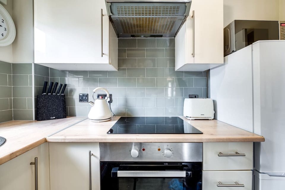 A fully equipped kitchen stocked with all the essentials you need to prepare and enjoy a home-cooked meal during your stay.