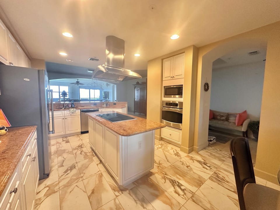 Counter space and an induction stovetop and wall over to cook all of your meals.