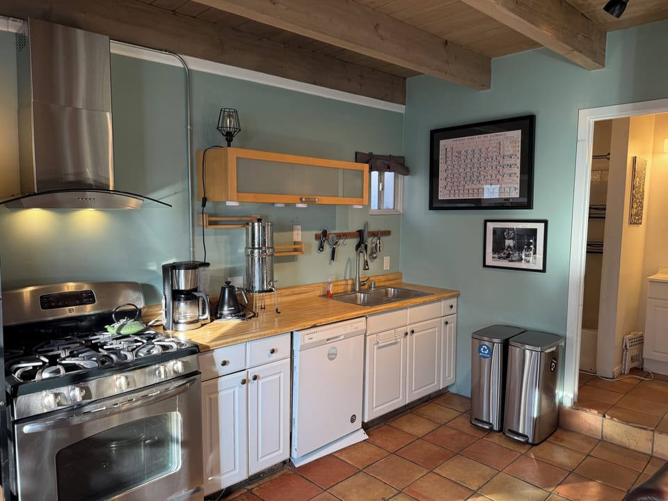 Full kitchen with stove, fridge, dishwasher & cooking supplies.