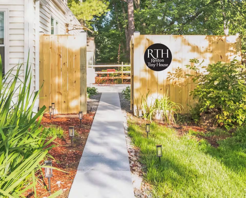 Private walkway to gated entrance and keyless entry front door.
