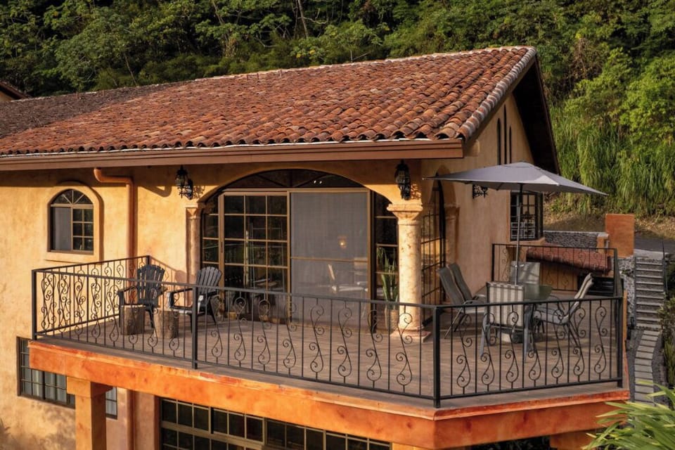 Charming wraparound balcony with beautiful, character-filled wrought iron rail.