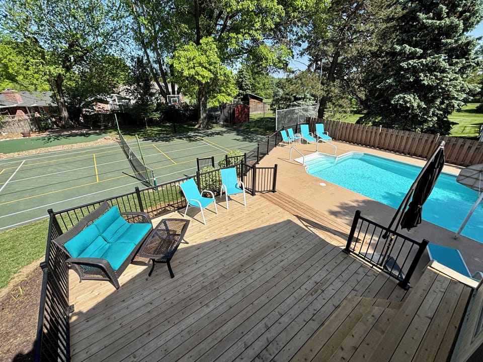 Resort style backyard with pool, pickleball court, putting green, and more! 
