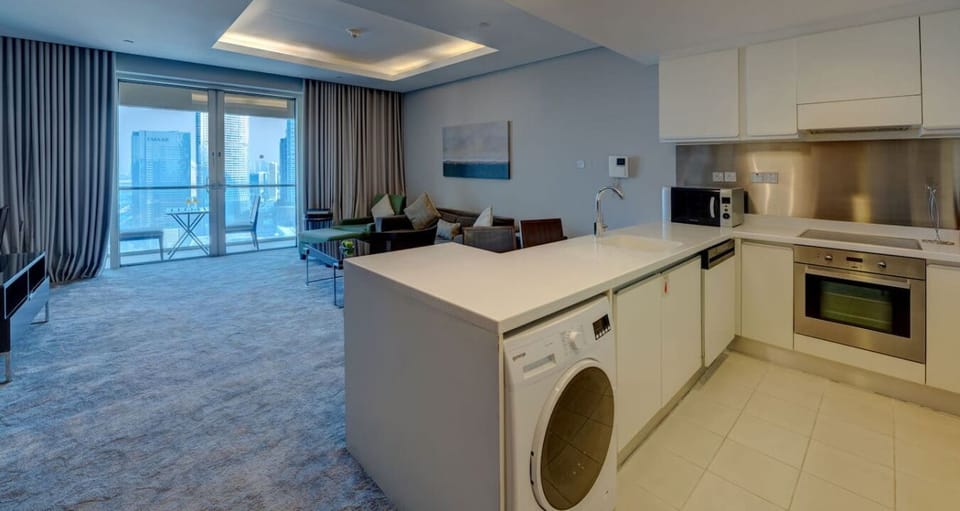 The kitchen and dining area layout and furnishings may vary slightly between rooms, yet each offers a stylish, comfortable, and well-appointed setting for your stay