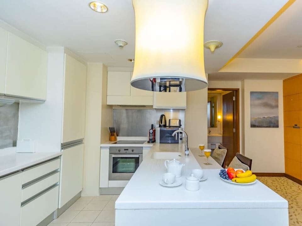 The kitchen and dining area layout and furnishings may vary slightly between rooms, yet each offers a stylish, comfortable, and well-appointed setting for your stay