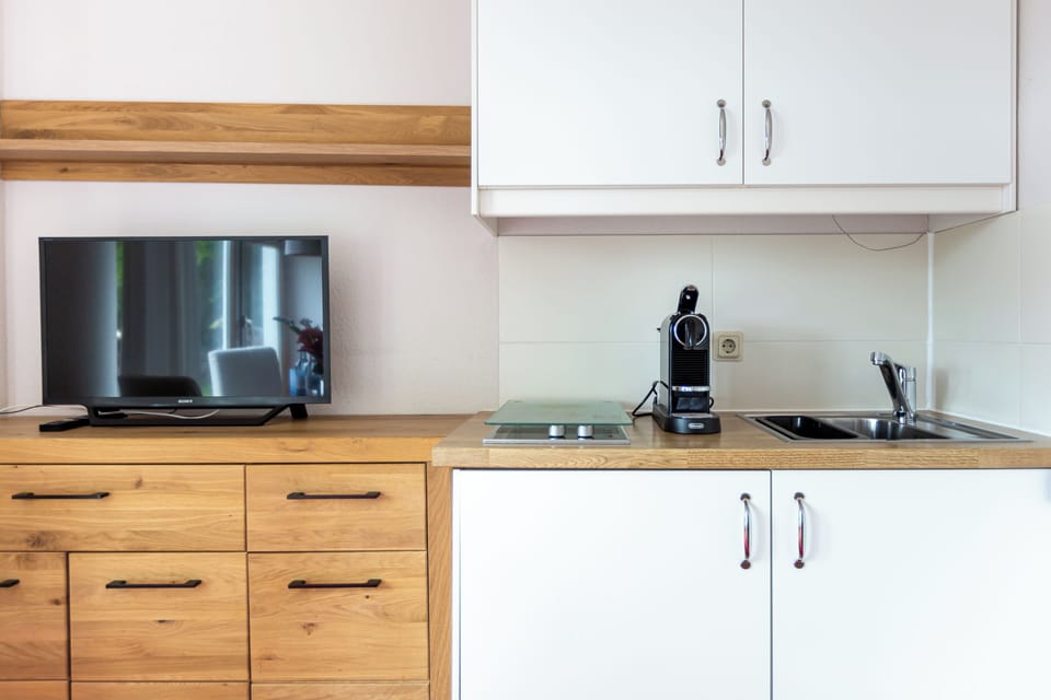 Modern Kitchen with TV and Cooking Area