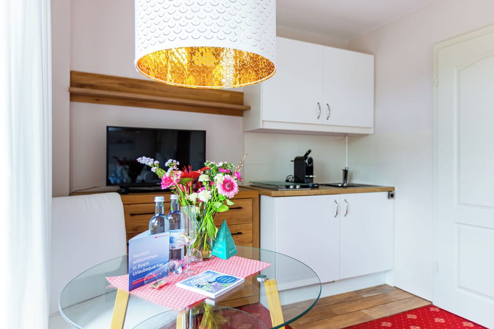Modern Kitchen with Table and TV