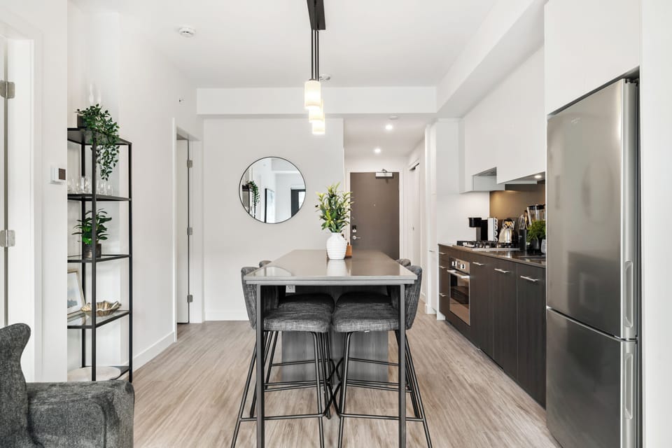 Welcome to First & Park, Calgary’s newest luxury high-rise in the heart of Eau Claire! Perched +10 floors above the ground, this stylish and modern 2-bedroom, 2-bathroom condo offers breathtaking city and river views from an oversized wraparound patio, high-end finishes, In-building gym, and an unbeatable location—perfect for business travellers, couples, or families.