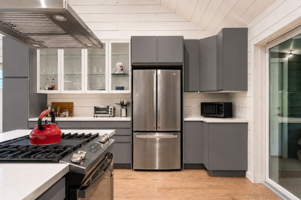 Grab something from the fridge or heat up a snack in the microwave. The gas stove and red kettle are ready whenever you want to cook or make tea.