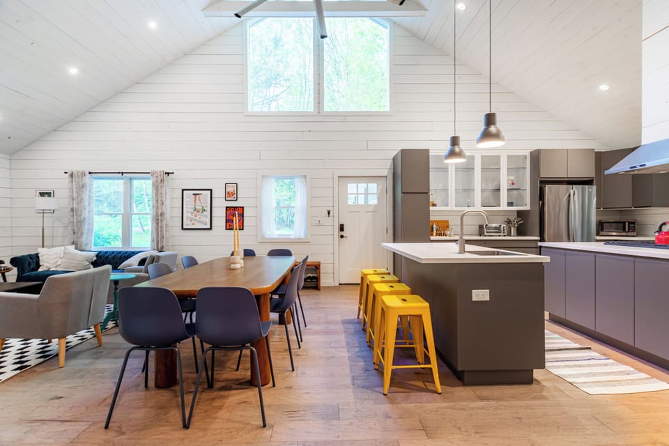 Dining area with a large table for 8, perfect for shared meals or game night.