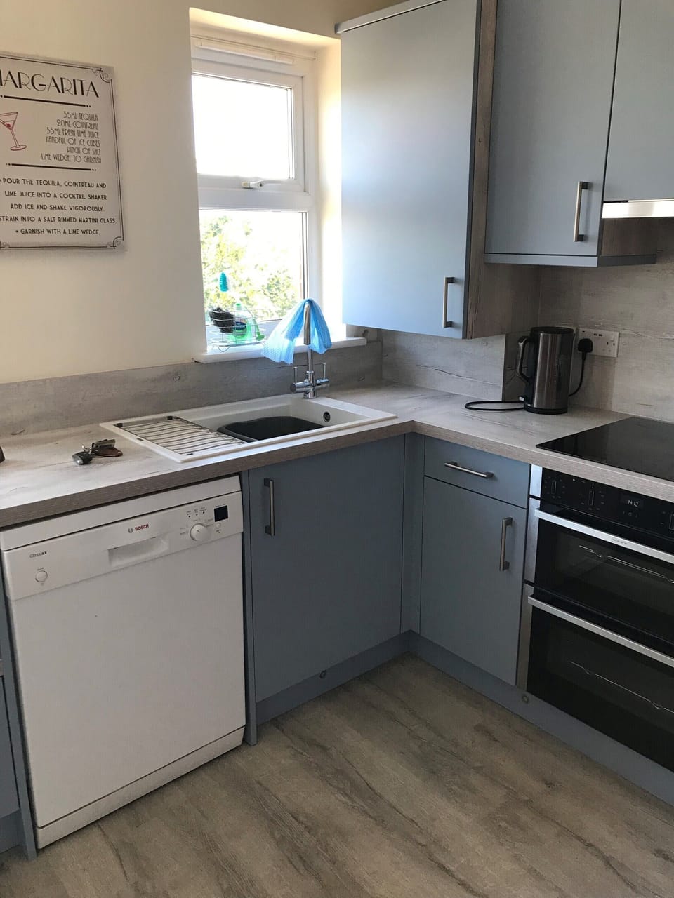 Kitchen with laundry appliances 