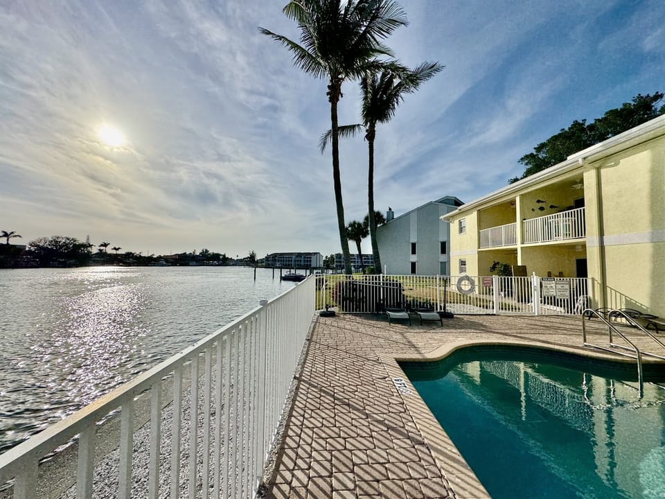 Whether you're diving in for a refreshing swim, relaxing poolside on one of the lounge chairs, or enjoying the warmth of the sun as you read a book, this space is designed for ultimate relaxation. 