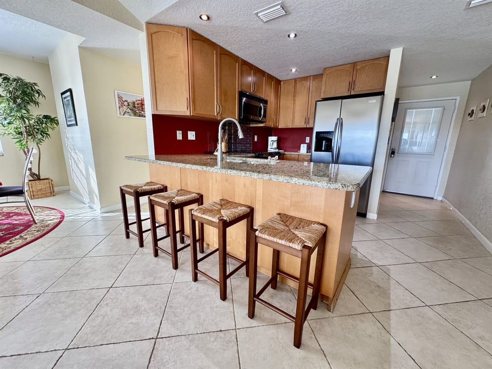This kitchen is perfect for cooking a hearty breakfast before a beach day or preparing a simple dinner to enjoy with loved ones