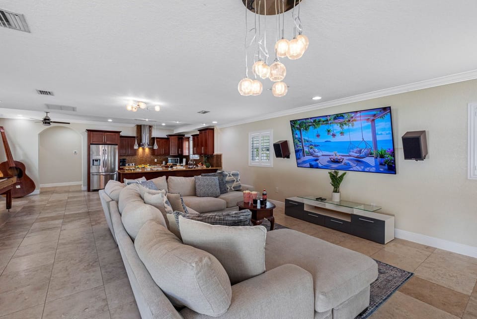 This welcoming space features a spacious, plush sectional sofa, perfect for stretching out and relaxing after a day of exploring, swimming, or sightseeing.