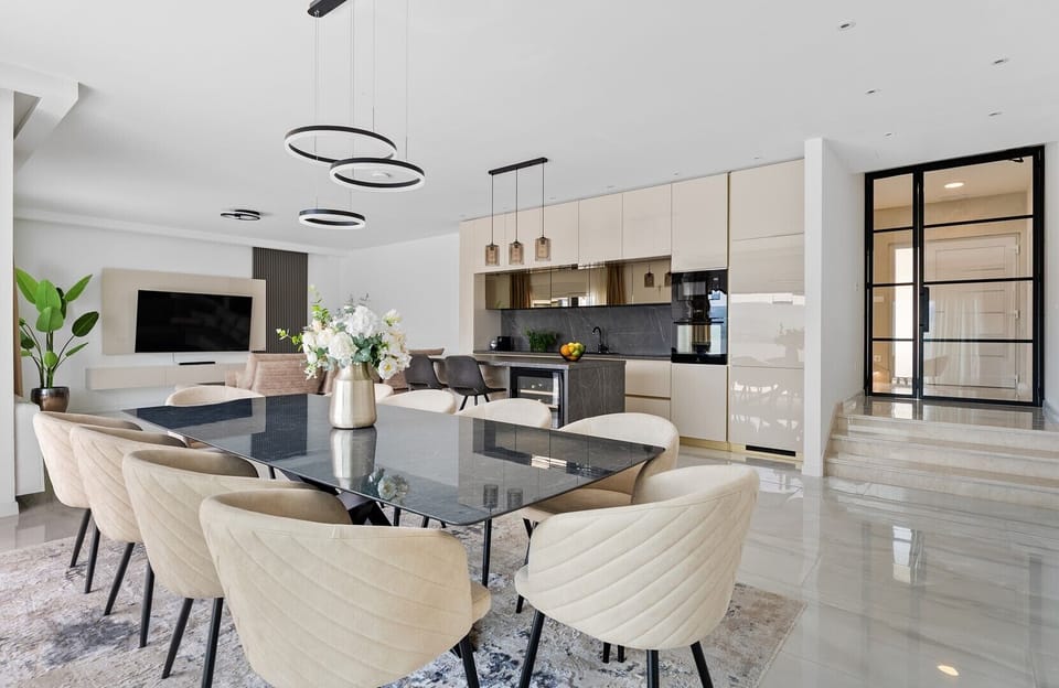 The ground floor unveils a sprawling 65 sqm living and dining area designed for relaxation and social gatherings