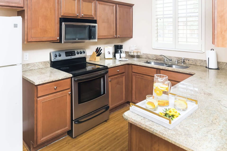 Kitchen equipped with stainless steel appliances and extra items