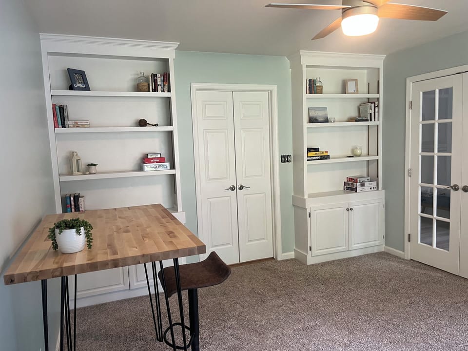 Office with workspace, quiet seating, games and puzzles.