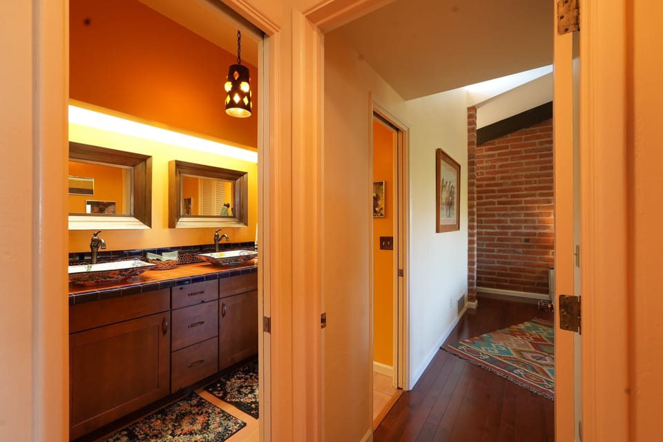 The principal ensuite is accessible to the living room