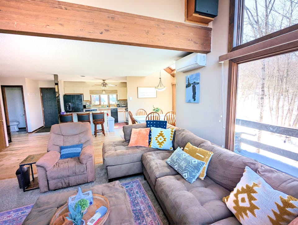 Well-Lit Living Room with Comfy Couches!