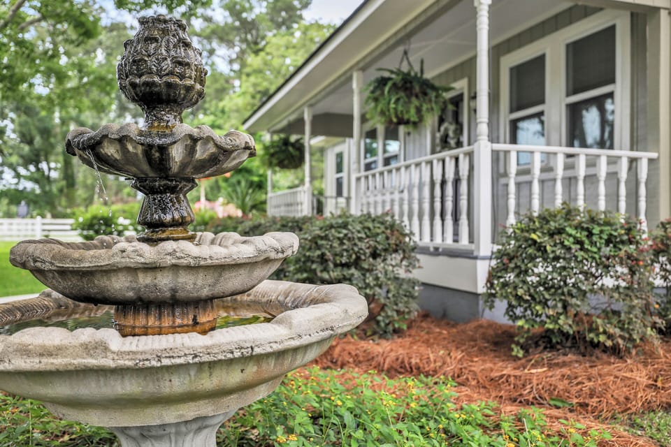 Tranquil fountain by front porch expansive