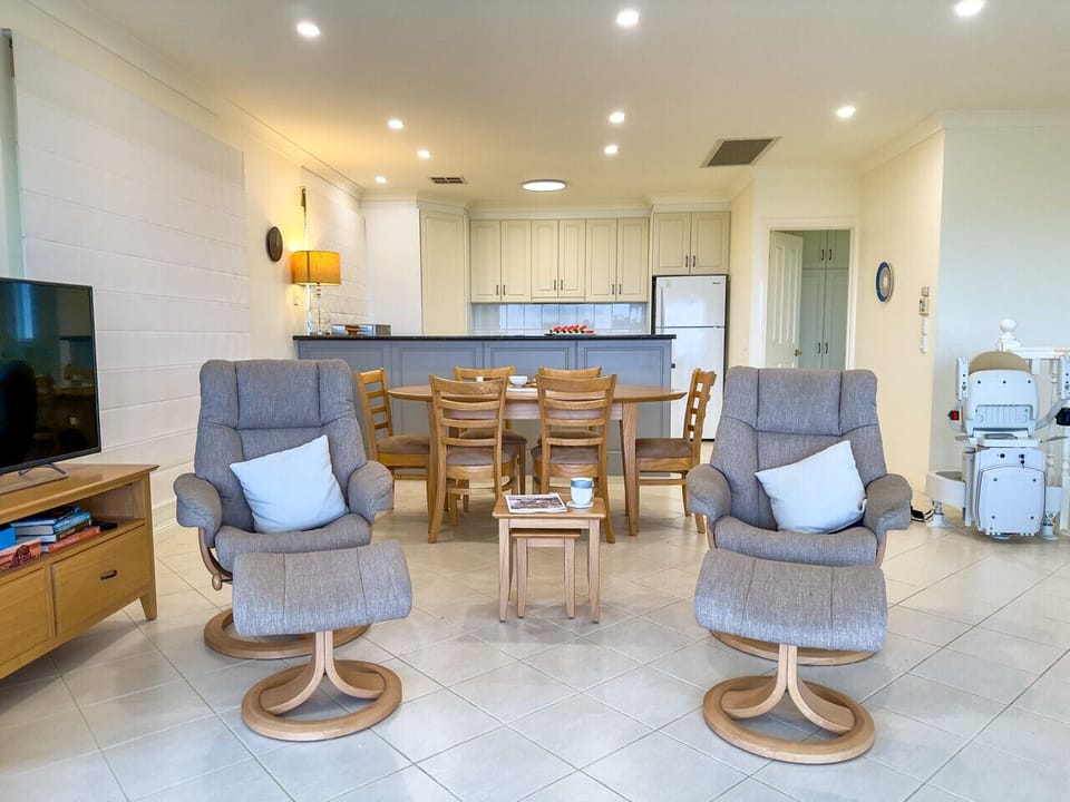 The dining, living and kitchen area upstairs are all adjoined to maximise the views whether you are cooking, eating or doing the dishes!