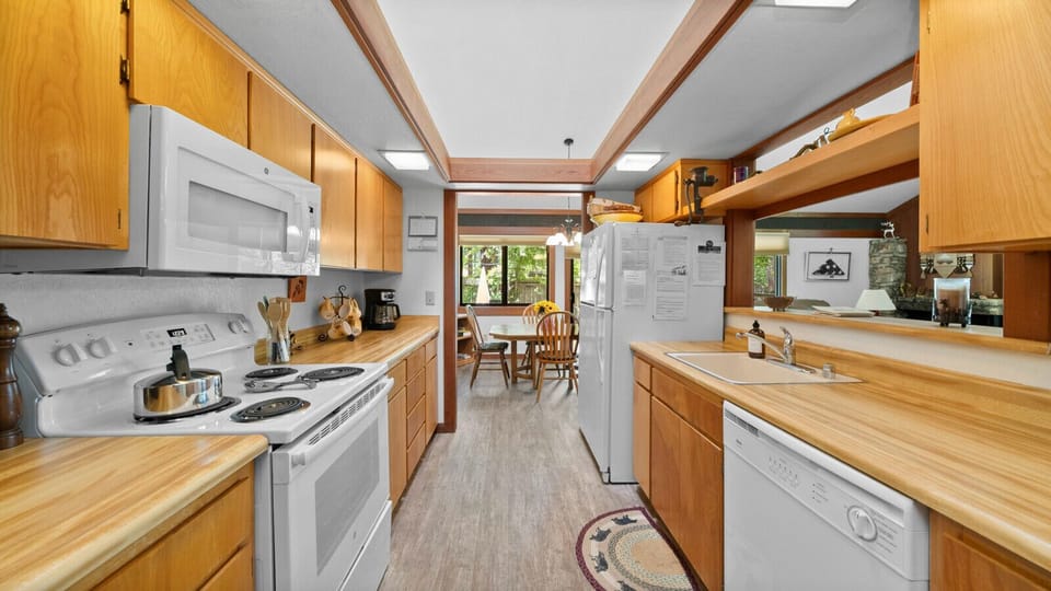 Galley kitchen stocked with all of your cooking needs