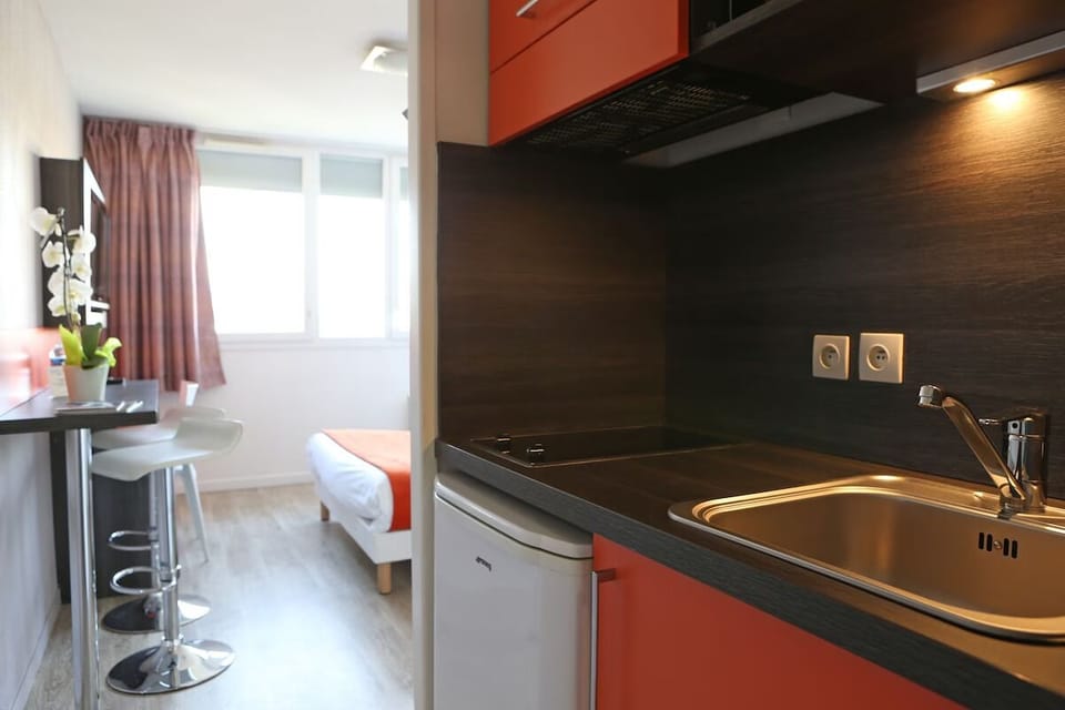 Start mornings with easy snacks in the sleek kitchenette nook.