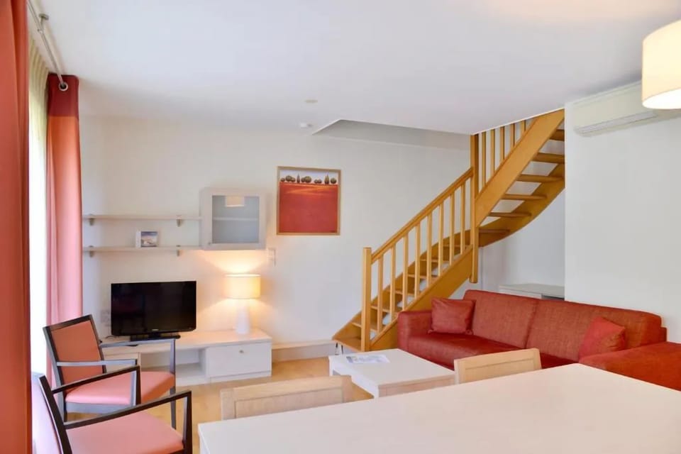 Gather in the airy living room with space to relax.