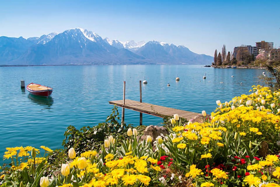 Stroll lakeside paths framed by flowers and sparkling water.