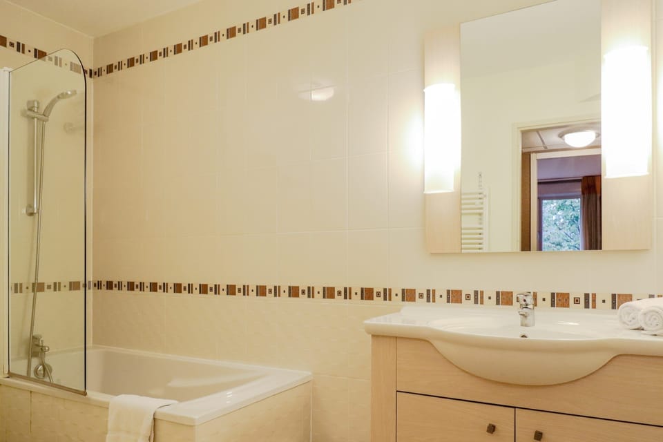 Enjoy a clean, well-lit vanity space for easy mornings.