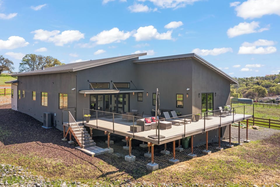 Large oversized deck for barbecuing, lounging and enjoying the scenery. 