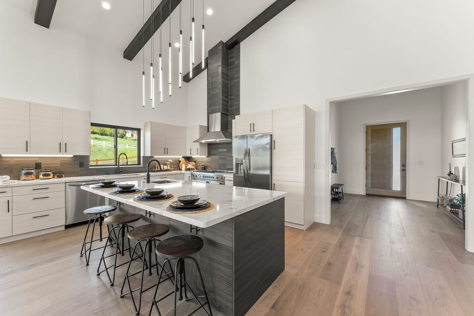 Chef's kitchen with large island with seating.