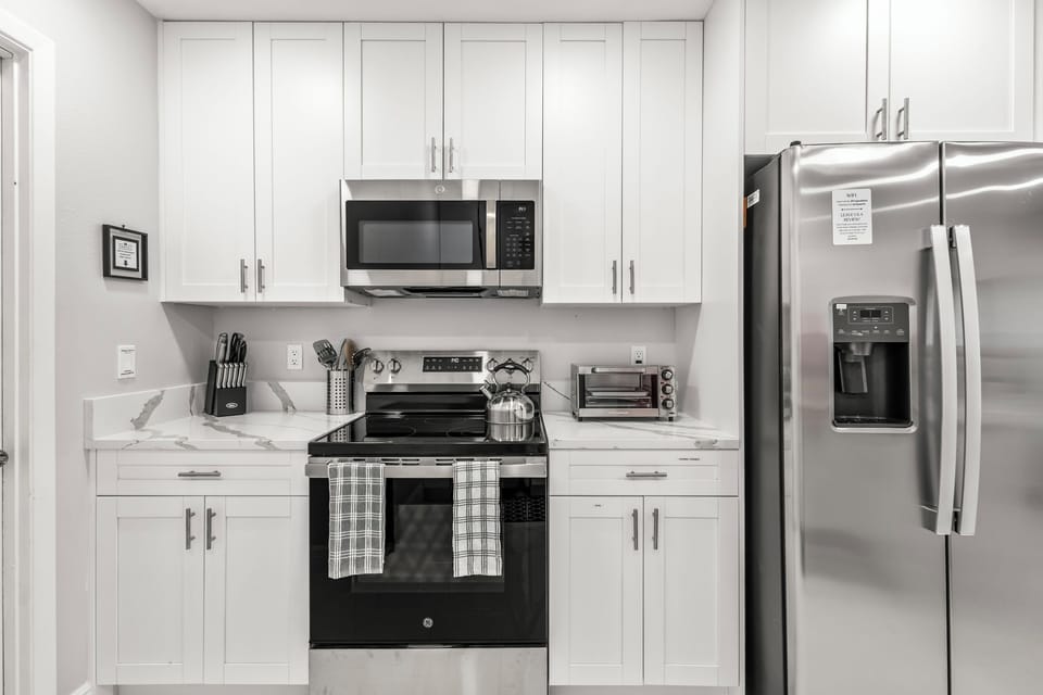 Newly remodeled kitchen with stainless steel appliances/ granite countertop.