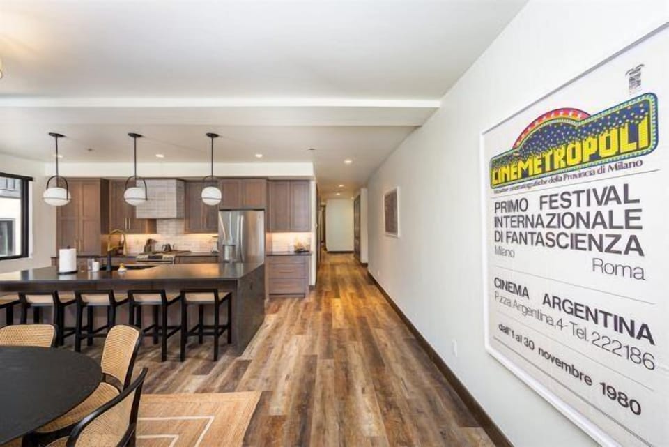 The main hallway of the home connects the living area with the bedrooms | Main Level