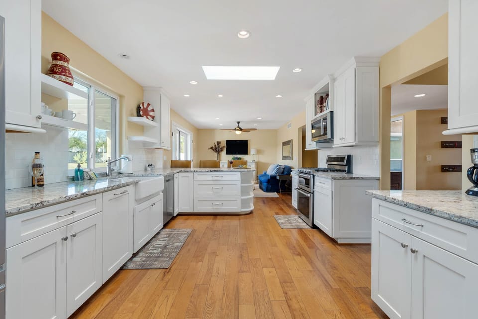 Fully Equipped Modern Kitchen with Stainless Steel Appliances and Stone Counters