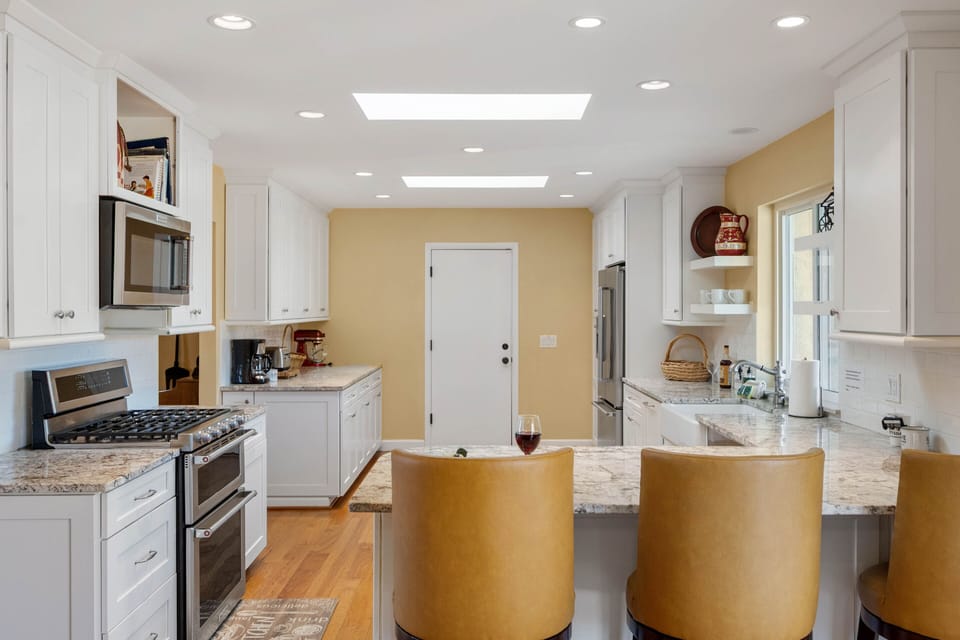 Fully Equipped Modern Kitchen with Stainless Steel Appliances and Stone Counters