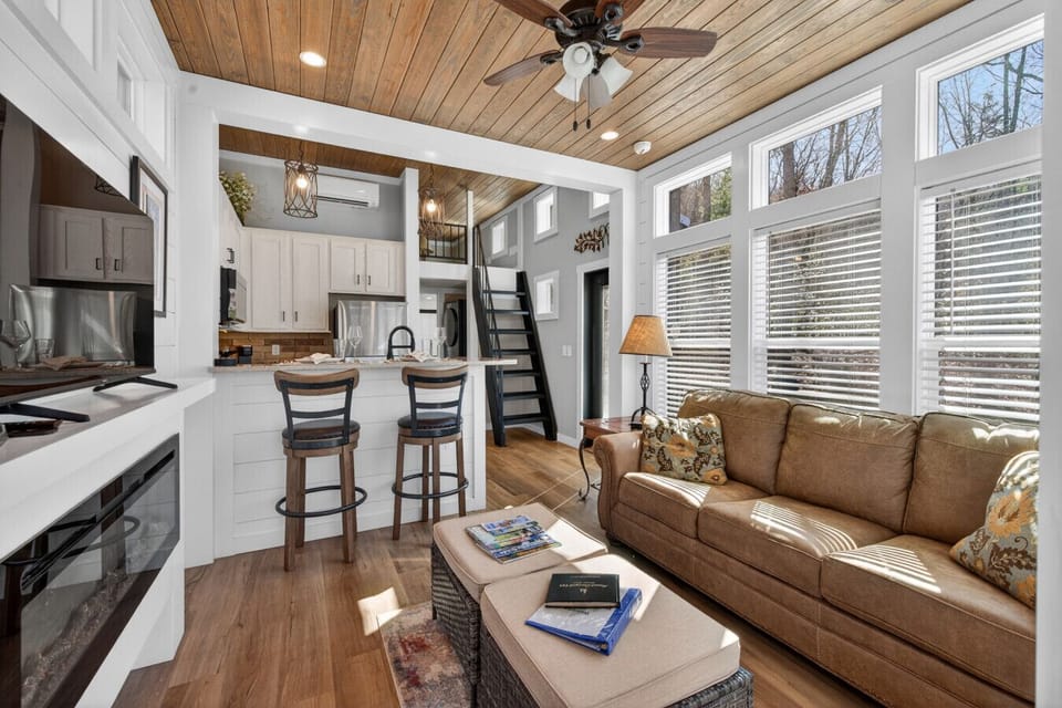 Open living space with full kitchen, loft access, and natural light—ideal for relaxing between hikes