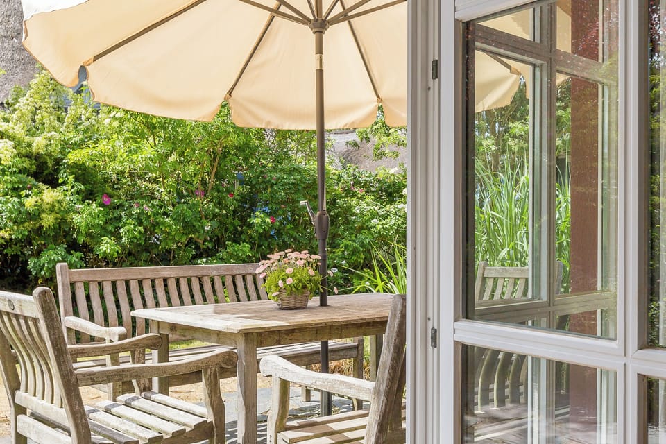 Terrace with Wooden Furniture and Umbrella