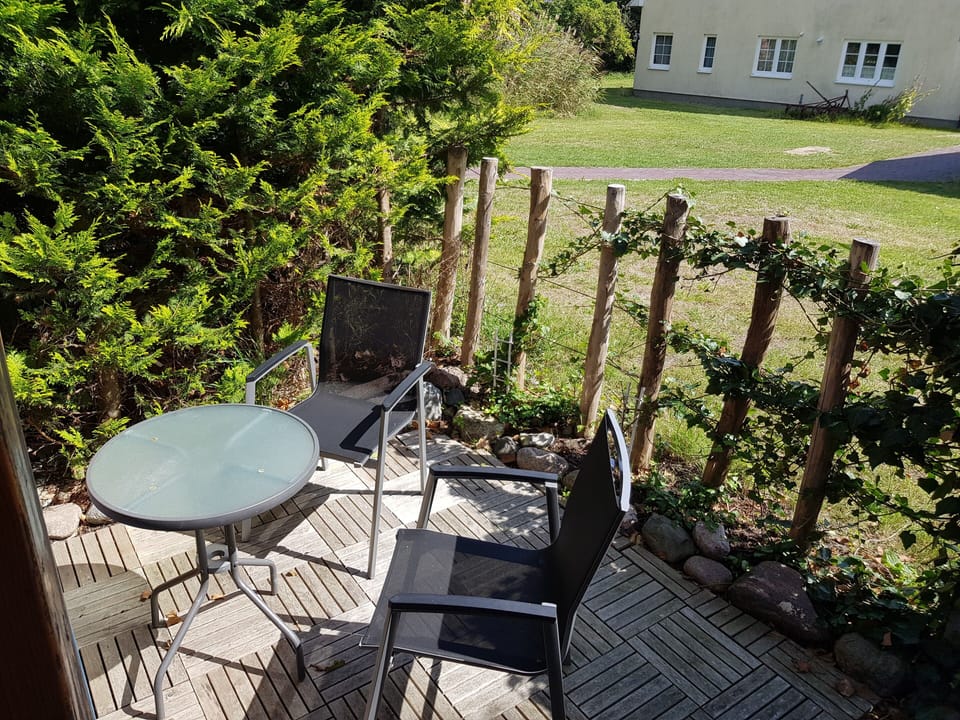 Cozy Terrace with Table and Chairs