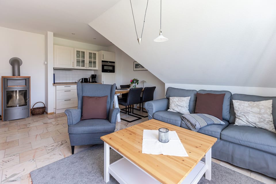 Cozy Living Room with Sofa and Dining Table