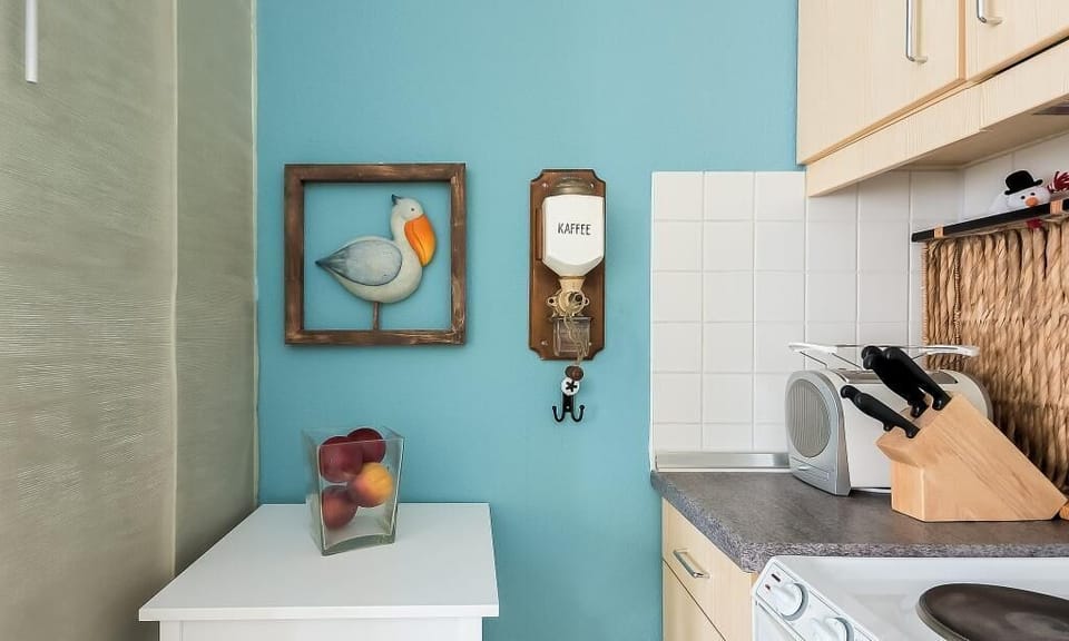 Kitchen corner with blue wall and utensils