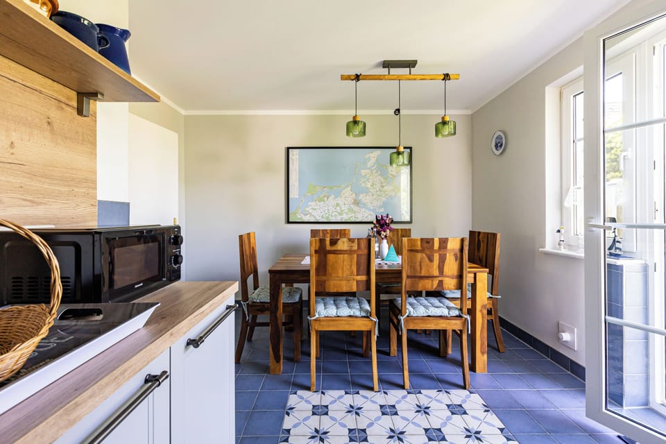 Kitchen with Dining Table and Wooden Chairs