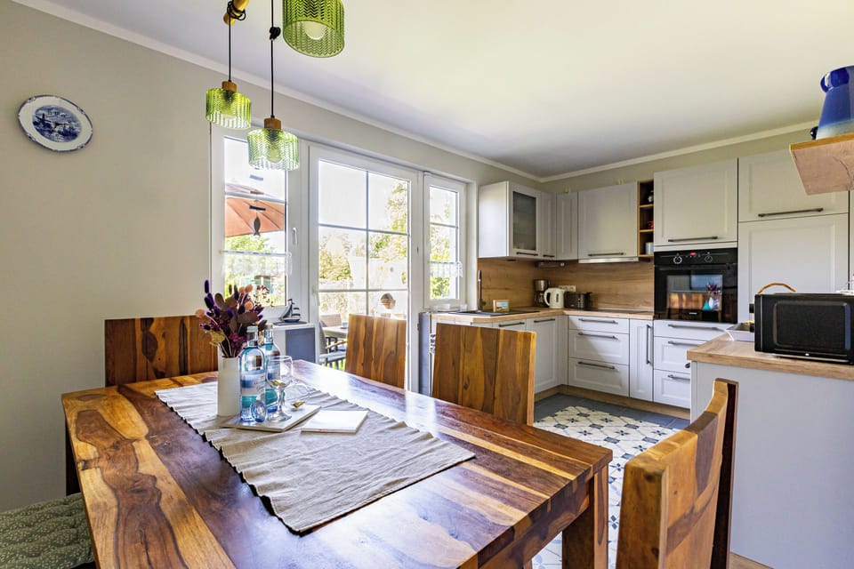 Modern Kitchen with Dining Table and Wooden Chairs
