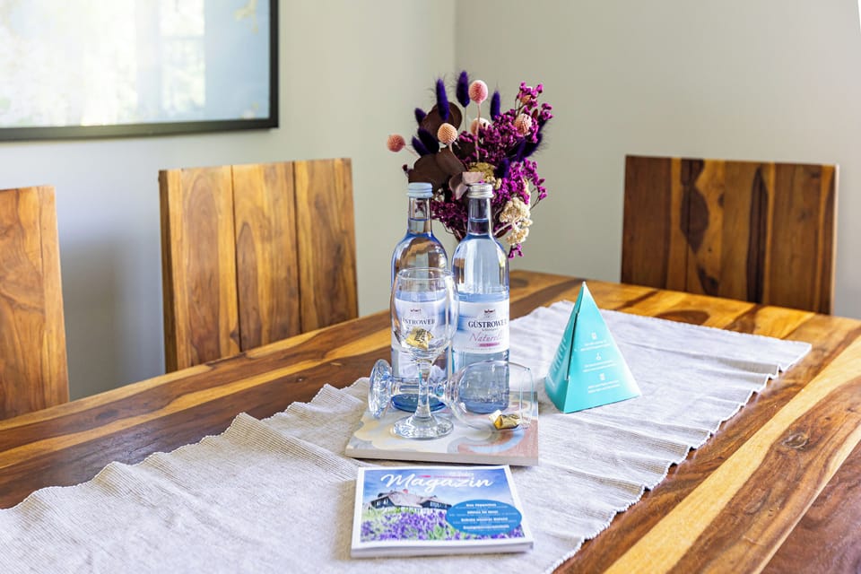 Kitchen Table with Water Bottles and Flowers
