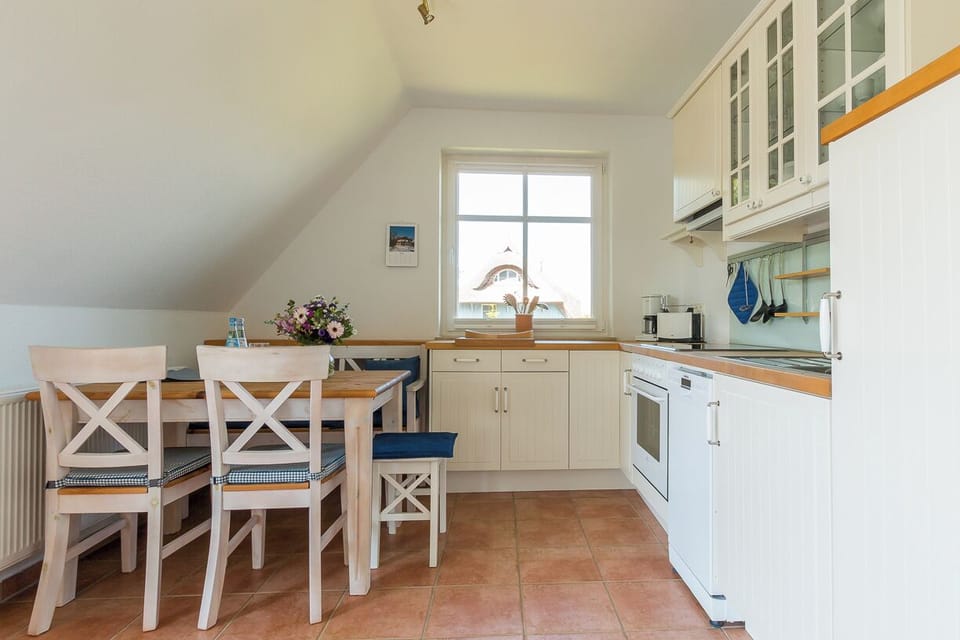 Bright Kitchen with Dining Table and Modern Appliances